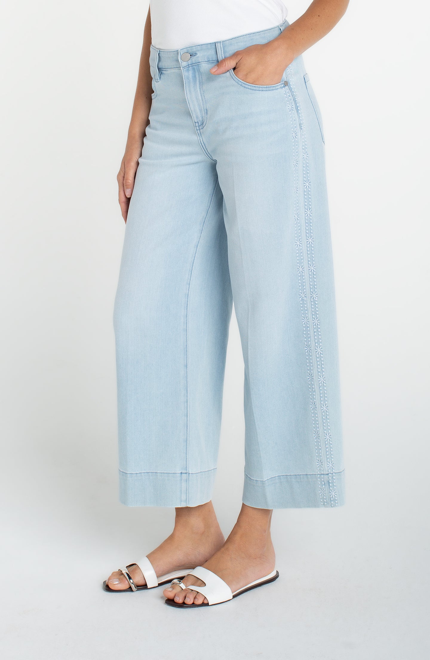 Light blue wide leg jeans with embroidered side seam worn by model, Marine Flowers Stride Crop Wide Led w/ Embroidered Side Seam by liverpool
