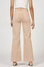 Rear view of a model wearing Fiona Warm Taupe Jeans by dear john in a flattering, versatile warm taupe color