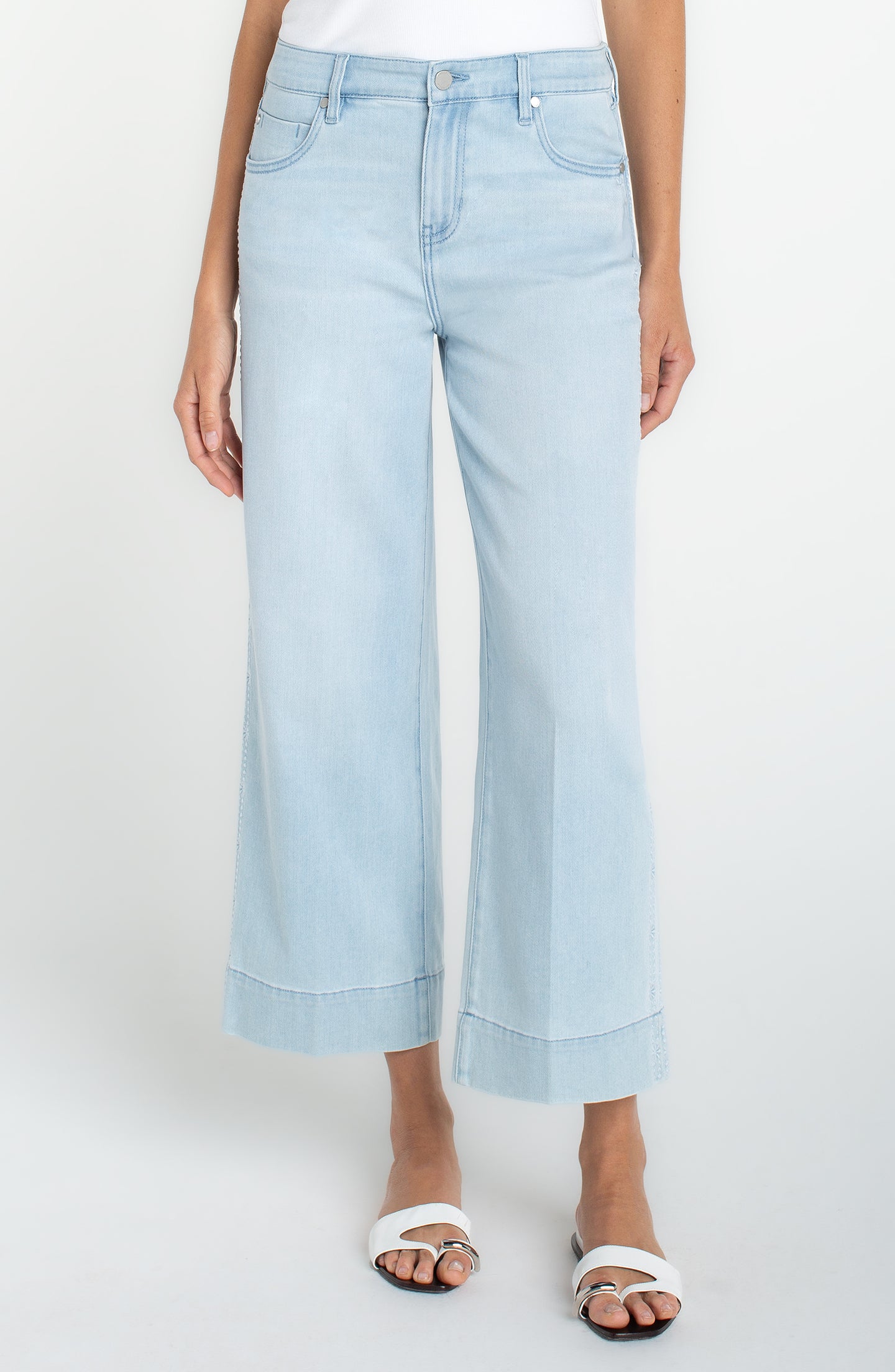 Front view of light blue Marine Flowers Stride Crop Wide Led w/ Embroidered Side Seam jeans by liverpool worn with white sandals