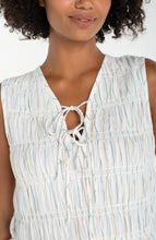 Close-up of a woman wearing a Cream/Blue Multi Stripe Sleeveless Tie Front Woven top by liverpool showing texture and tie details