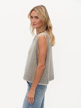 Side view of a woman wearing a Heather Grey Maria Double Layered Vest by six/fifty with clean lines and modern design