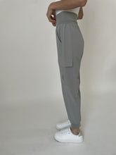 Side view of model wearing six/fifty Taupe Kristie Lightweight Jogger with high waist and cuffed ankles