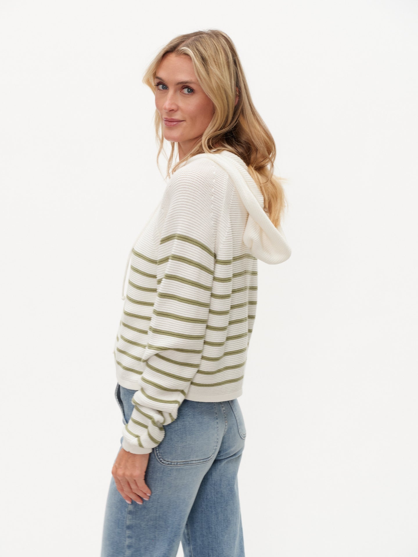 Woman wearing Annalora Striped Button Up Hoodie by six/fifty with green stripes and hood in relaxed casual style