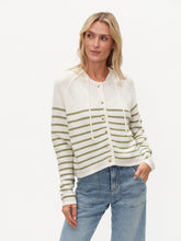Woman wearing six/fifty Annalora Striped Button Up Hoodie with green stripes and button closure standing with hand in pocket