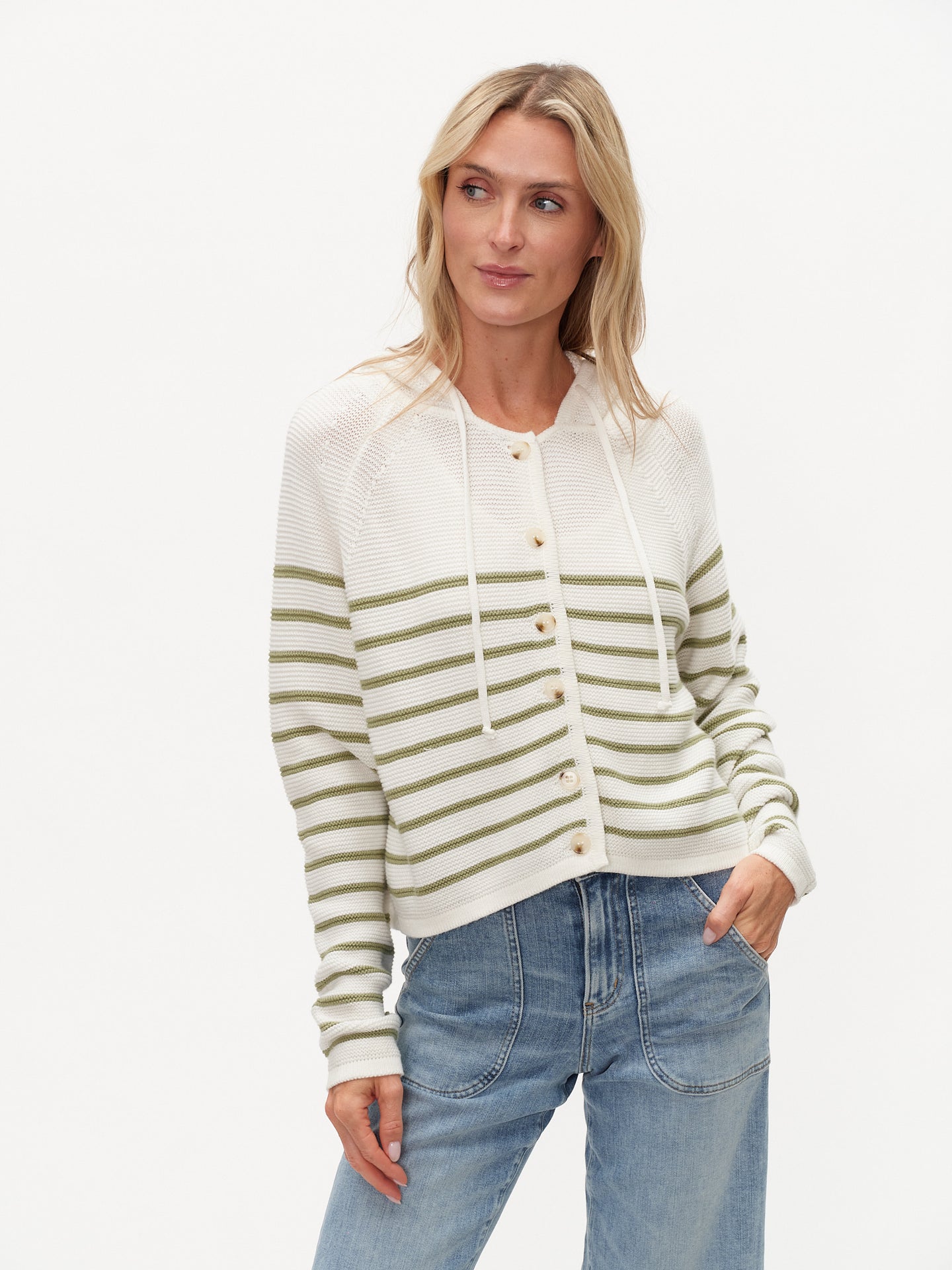 Woman wearing six/fifty Annalora Striped Button Up Hoodie with green stripes and button closure standing with hand in pocket