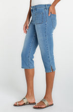 Woman wearing light blue denim Ocean Breeze Capri with Patch Pockets 19