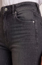 Close-up of black denim jeans with studded detailing on the thigh, featuring Heirloom Lucy Boot 30” Ins by liverpool
