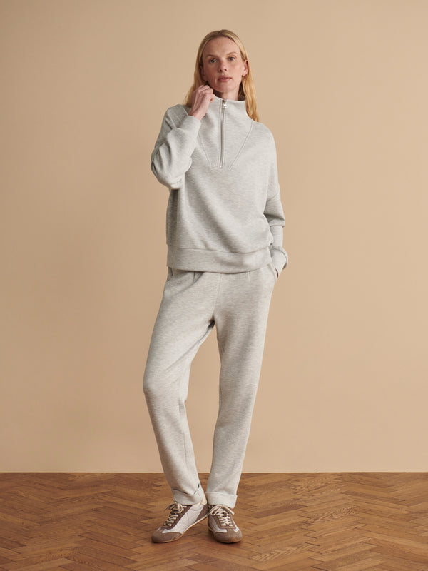 Varley Light Grey Marl The Rolled Cuff Pant 25 worn by a model in a relaxed outfit