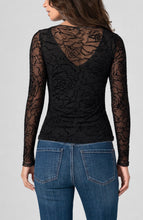 Back view of woman wearing Black Roses Layered Knit Top with V Detail by liverpool, paired with blue jeans
