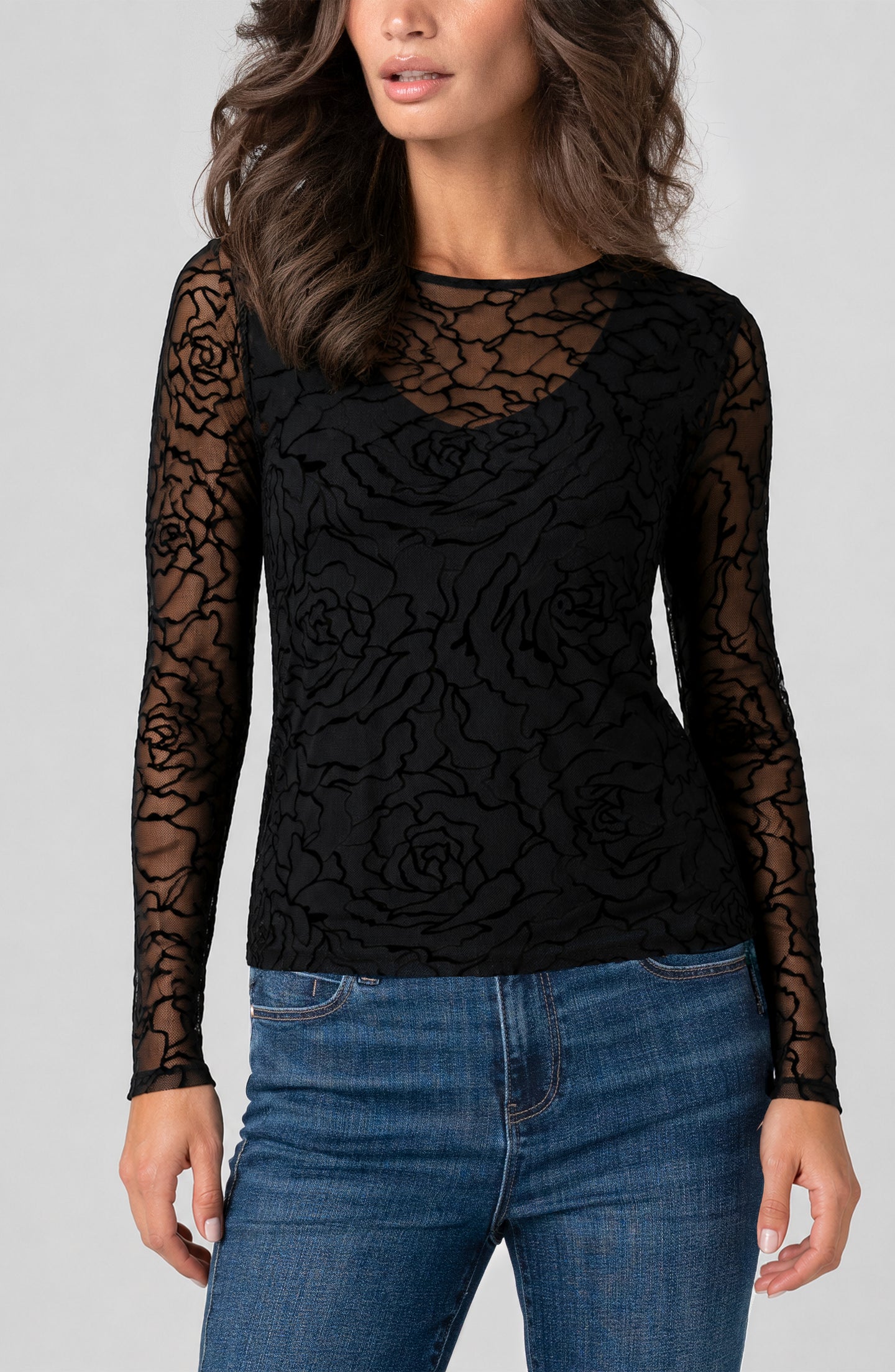 Woman wearing Black Roses Layered Knit Top with V Detail by liverpool, featuring sheer floral sleeves and layered design.