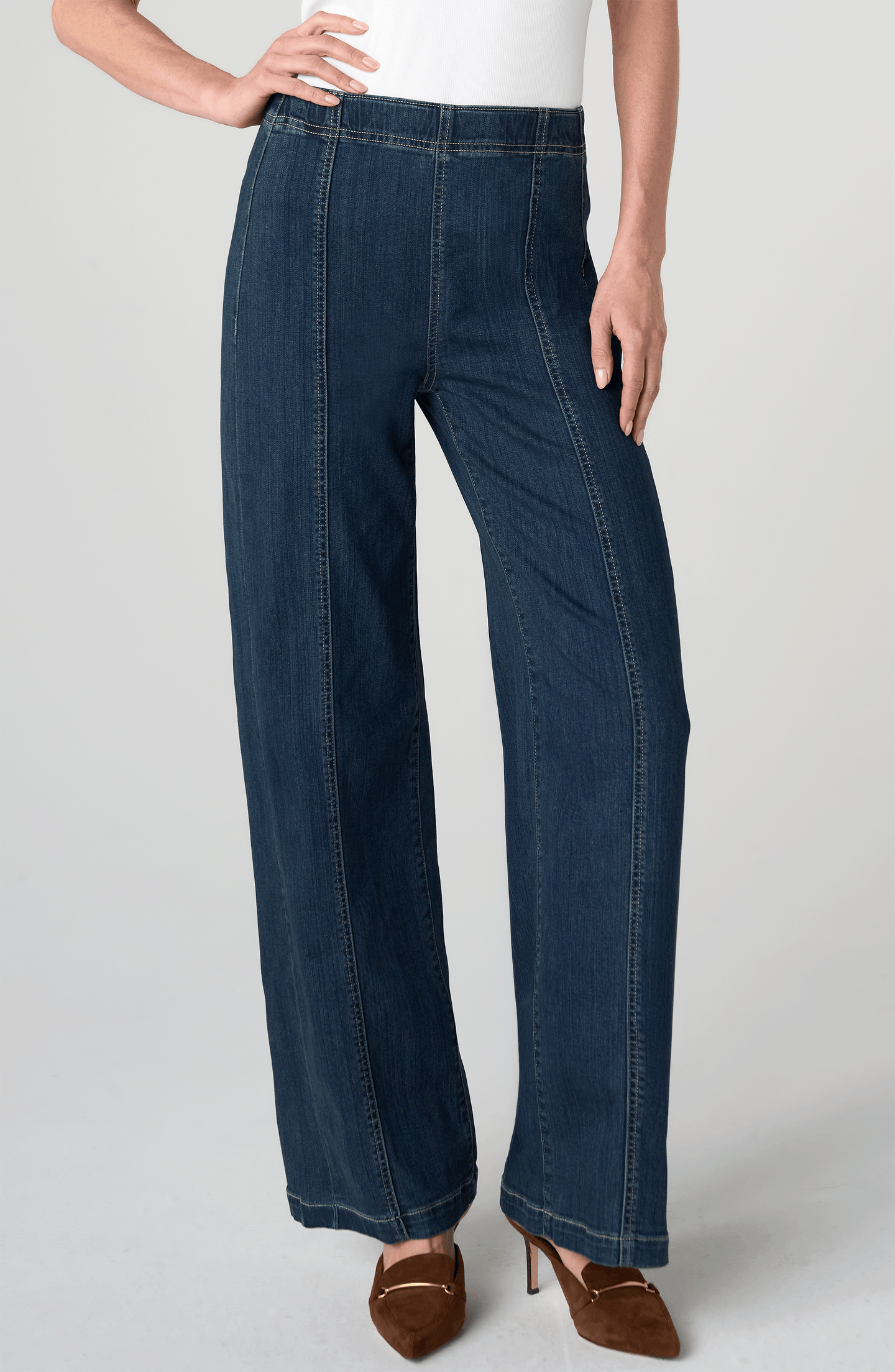Woman wearing Crosswind High Rise Pull-On Wide Leg with Seam Detail 32" Ins by liverpool in dark denim