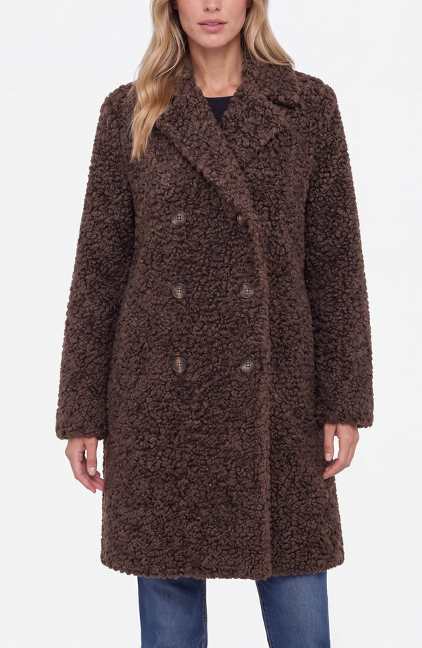 Woman wearing a Teddy Brown Double Breasted Coat by liverpool with textured fabric and button details over blue jeans