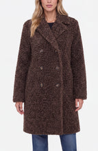 Woman wearing a Teddy Brown Double Breasted Coat by liverpool with textured fabric and button details over blue jeans