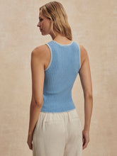 Woman wearing a Mist Blue Hanson Rib Knit Tank by Varley, showing the textured ribbed fabric from the back.