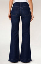 Back view of a person wearing dark denim Halifax Lucy Bootcut with Wide Hem 32” Inseam by liverpool jeans