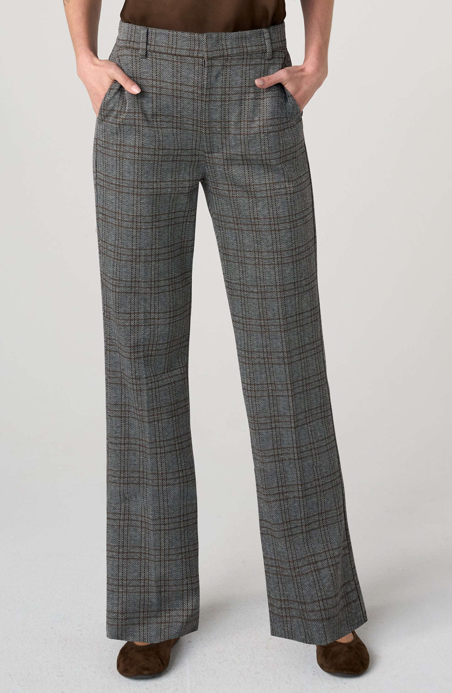 Woman wearing grey plaid Herringbone Kelsey Wide Leg Trouser by liverpool with hands in pockets and brown shoes