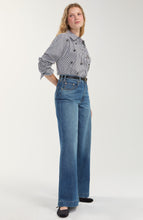 Model wearing Black/White Stripe Long Sleeve Shirt with Embellishment by liverpool paired with blue jeans and black shoes