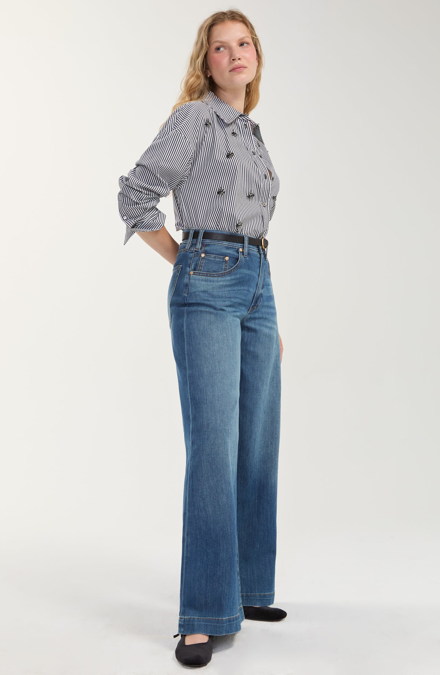 Model wearing Black/White Stripe Long Sleeve Shirt with Embellishment by liverpool paired with blue jeans and black shoes