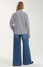 Back view of a person wearing a Black/White Stripe Long Sleeve Shirt with Embellishment by liverpool and wide-leg jeans