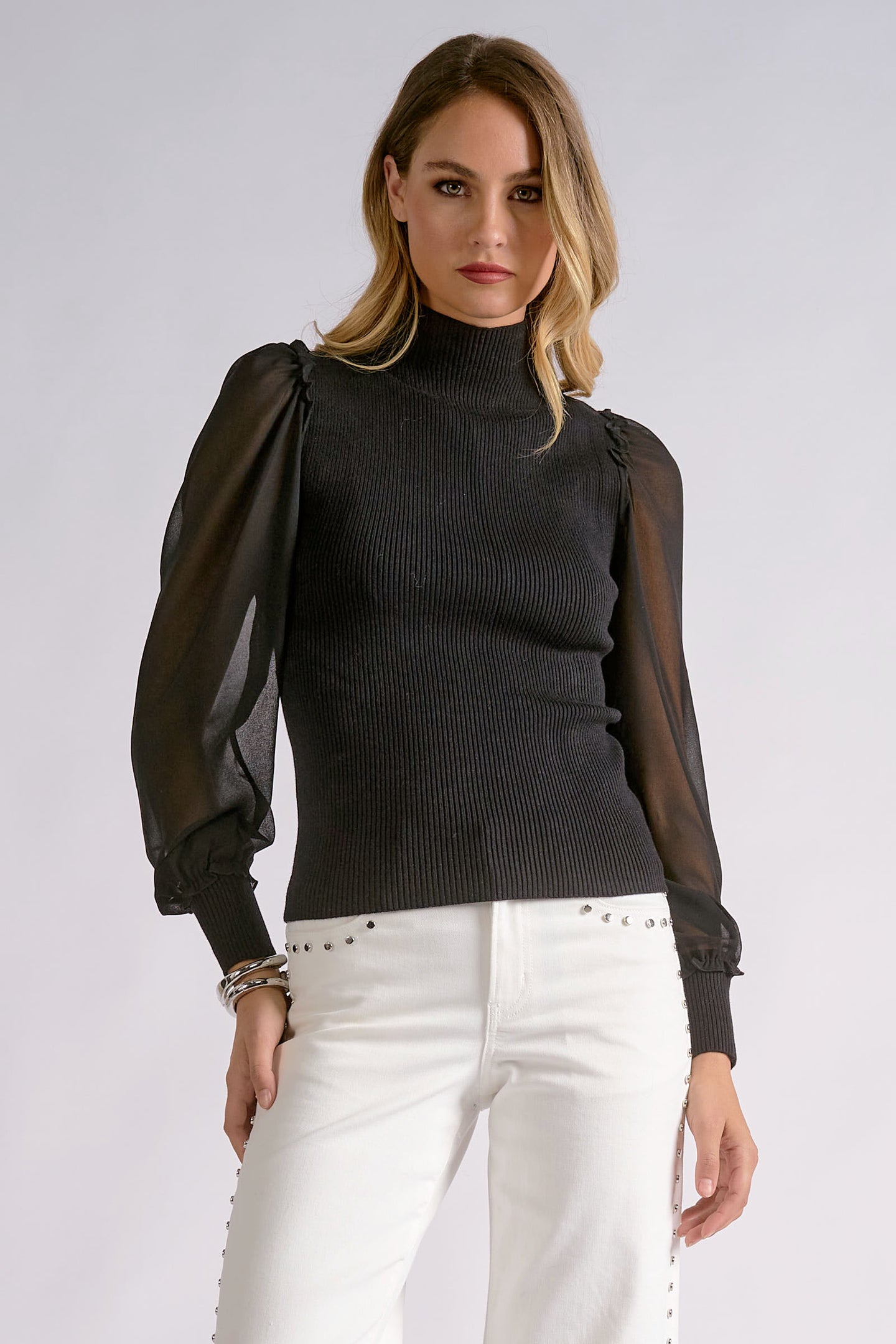 Elan Onyx black high-neck top with sheer sleeves, front view