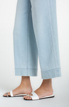 Light blue wide-leg cropped pants with floral embroidered side seams worn with white slide sandals Marine Flowers Stride Crop Wide Led w/ Embroidered Side Seam