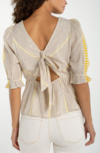 Back view of a woman wearing a Cream Brown Half Sleeve Square Neck Tie Back Woven Top from liverpool with a tied bow detail.
