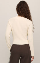 Back view of a woman wearing a cream Sandstone Summit Half Zip Sweater by z supply with long sleeves and ribbed texture