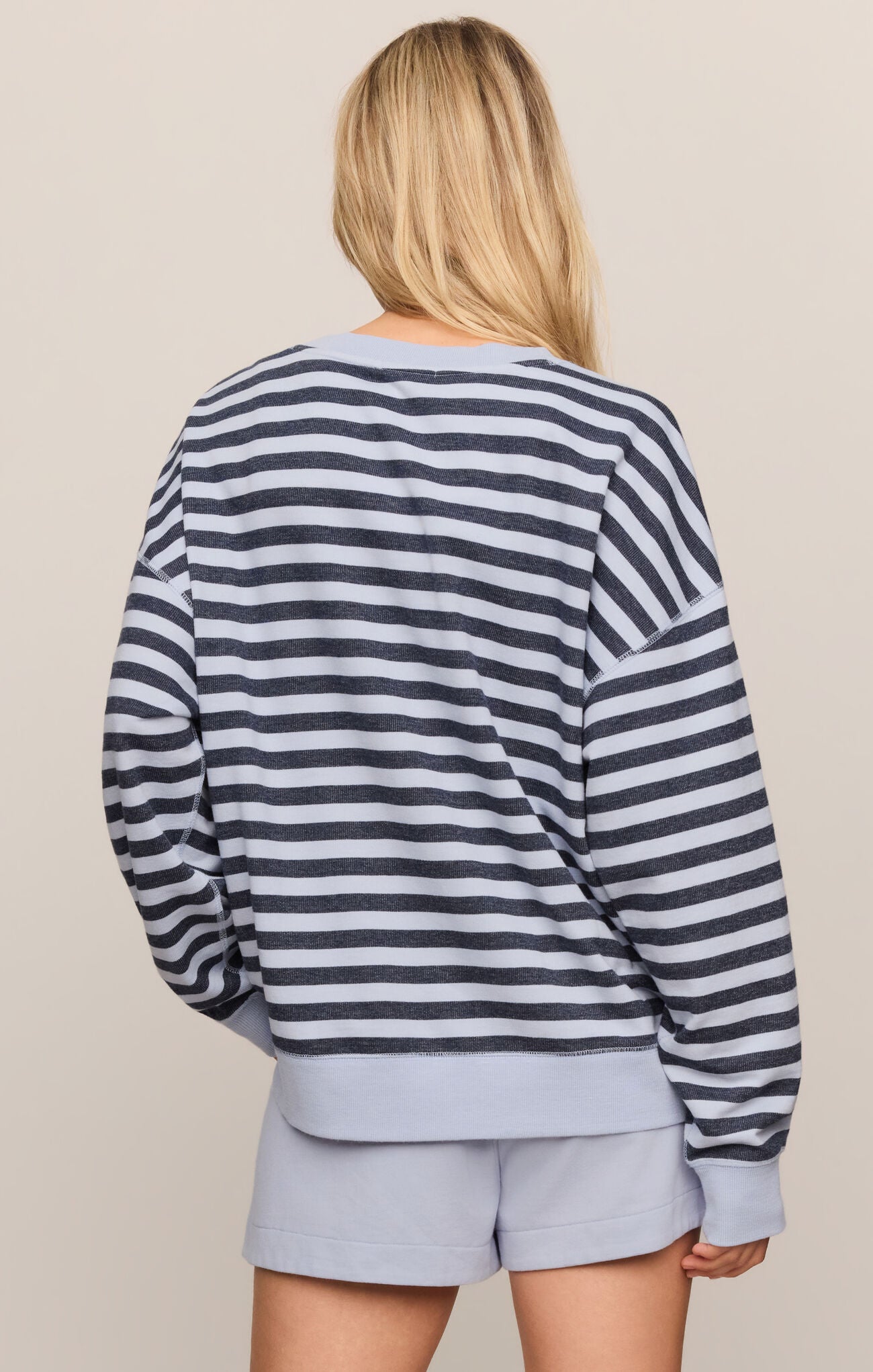 Back view of a woman wearing z supply Eclipse The Everyday Striped Crew in navy and light gray stripes with matching shorts
