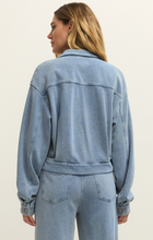 Back view of Ocean Air Indigo Heritage Knit Denim Jacket by z supply showing breathable knit fabric and relaxed fit design.