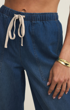Close-up of Z Supply Deep Water Daycation Denim Utility Pant with elastic waistband and front pockets in deep blue denim