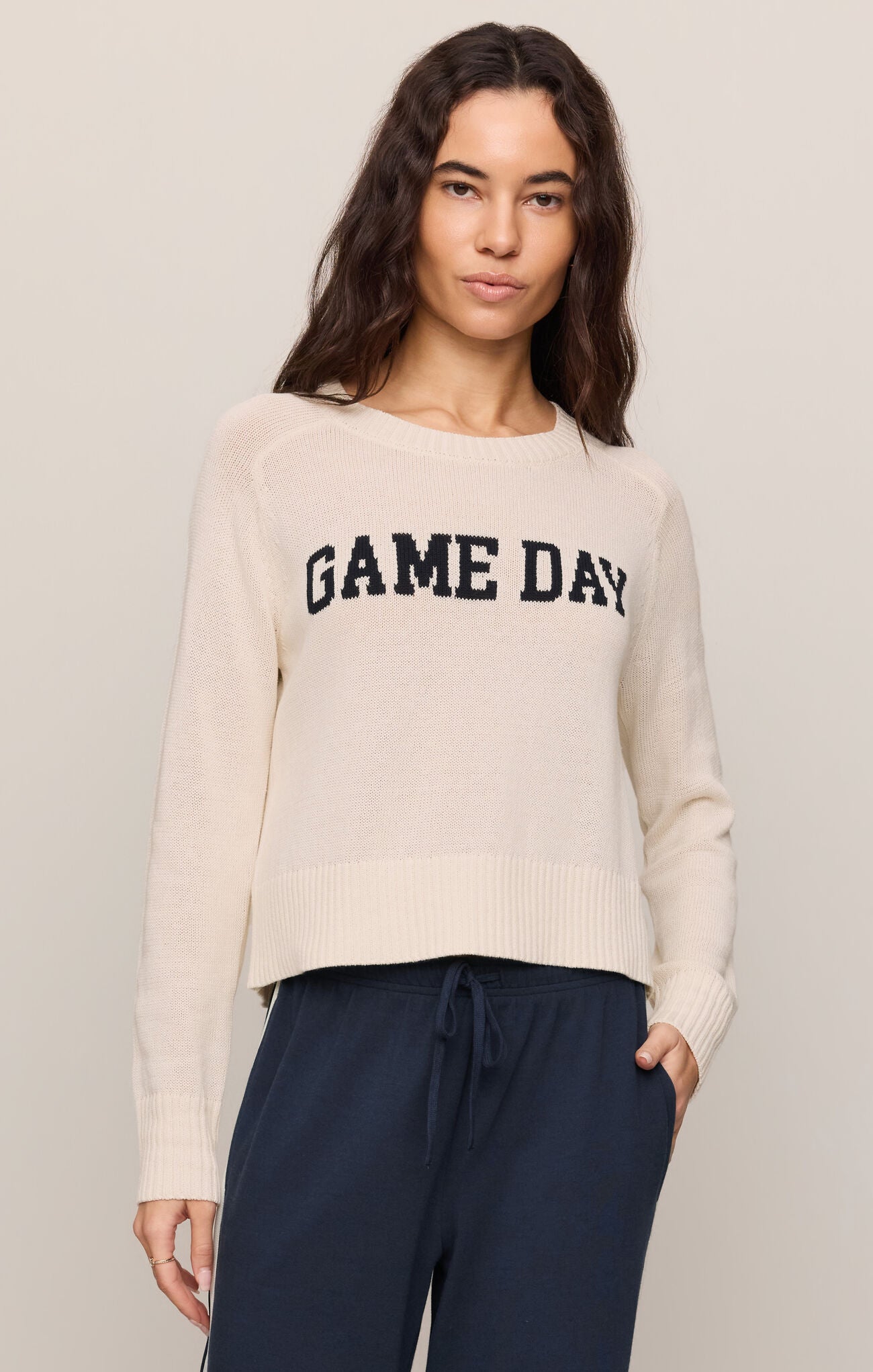 Woman wearing z supply Sandstone Varsity Stand in Sweater with "GAME DAY" text in casual neutral tones